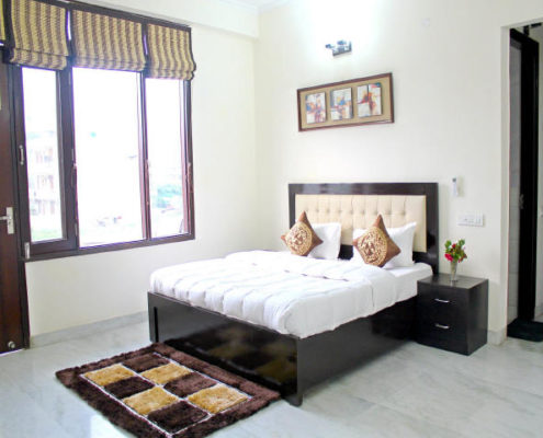 Serviced apartments in Gurgaon for short long stay rentals with furnished bedroom and modern amenities.