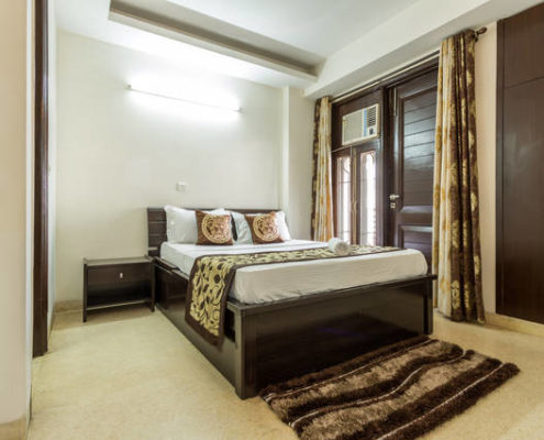 Serviced apartments in Gurgaon for short long stay rentals with furnished bedroom and modern amenities.