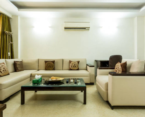 Service apartments in Gurgaon for short long stay rentals with furnished Living room.