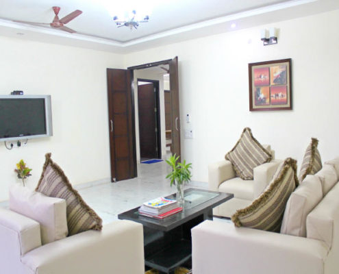 Serviced apartments in Gurgaon for short long stay rentals with furnished living room.